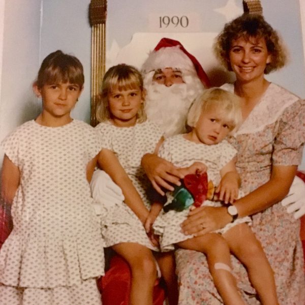 Christmas photo with girls in matching dresses