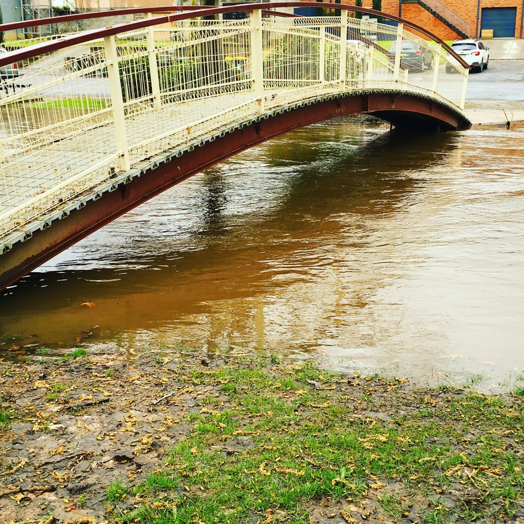Flood waters under the bridge in Tumbarumba