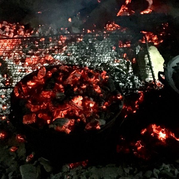 Camp oven cooking away amongst the coals