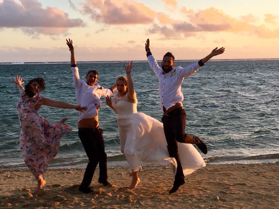Jumping for Joy on the beach at Outrigger Resort in Fiji after Wedding