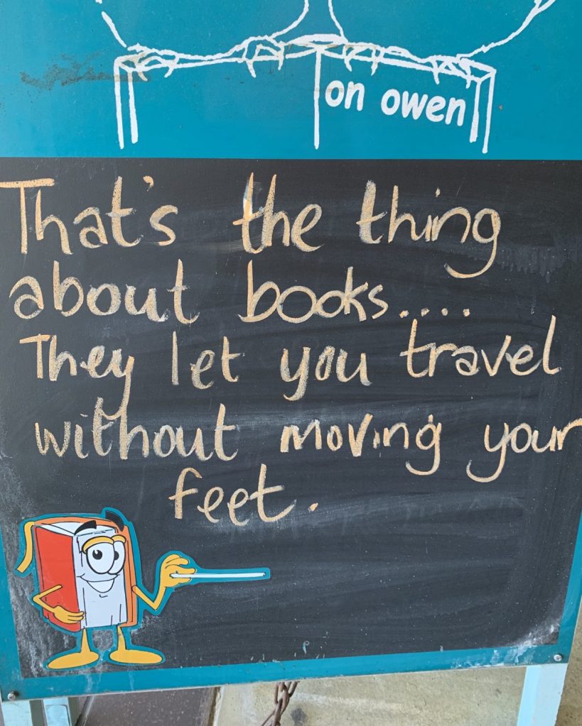 Travel sign outside a bookshop